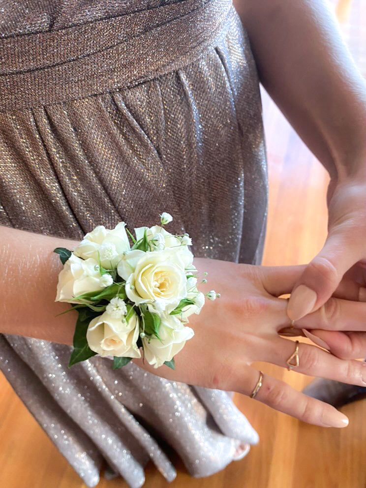 Wrist corsage , white spray roses. 